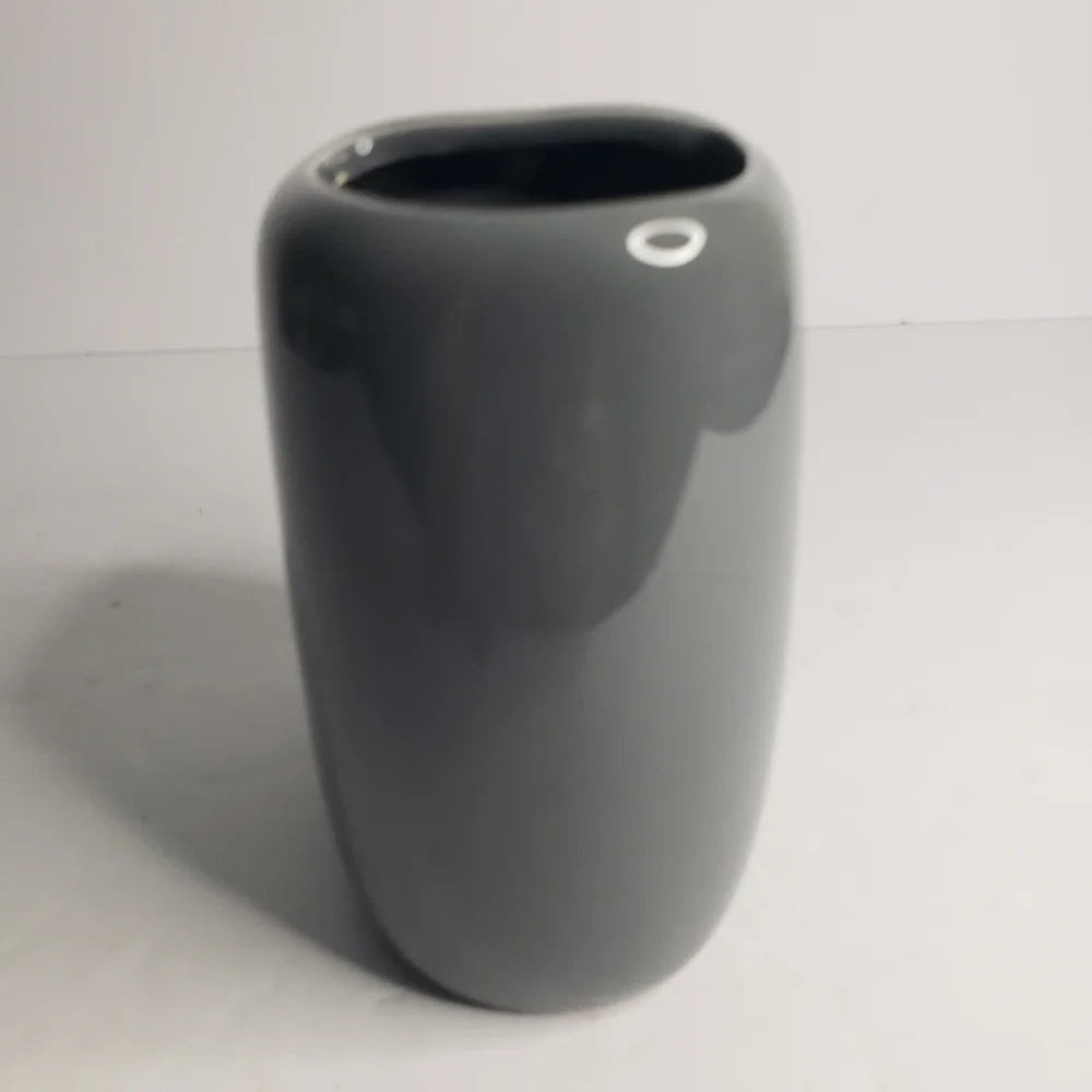 Ceramic toothbrush and toothpaste holder. 171